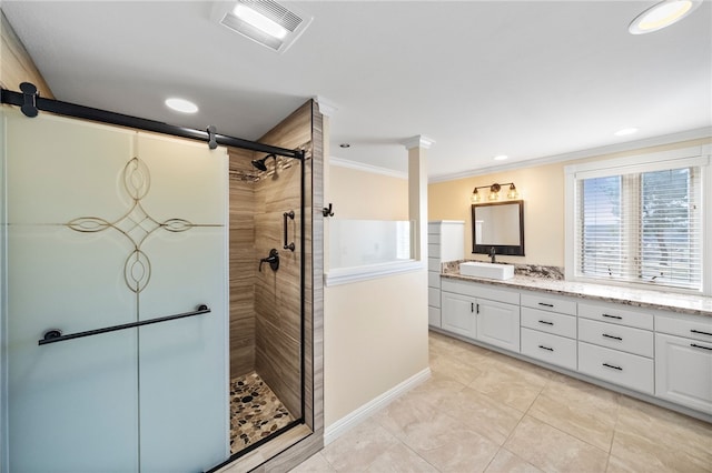 full bathroom with a stall shower, baseboards, visible vents, crown molding, and vanity