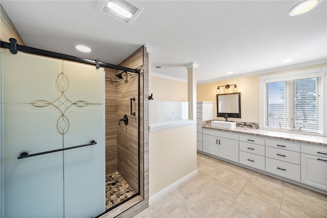 39725 Ivan Dr, Anza, CA 92539 - bathroom featuring crown molding, double vanity, a stall shower, baseboards, and tile patterned flooring
