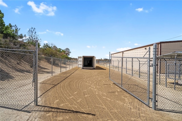 view of home's community featuring fence