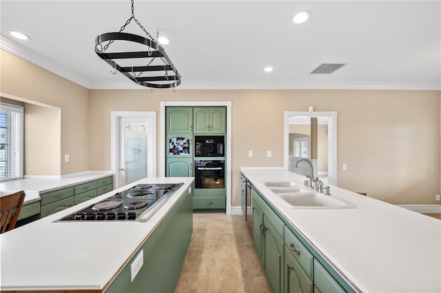 39725 Ivan Dr, Anza, CA 92539 - kitchen with green cabinetry, black appliances, a center island, a sink, and ornamental molding