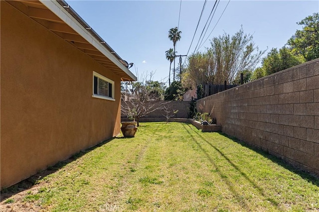 view of yard with a fenced backyard