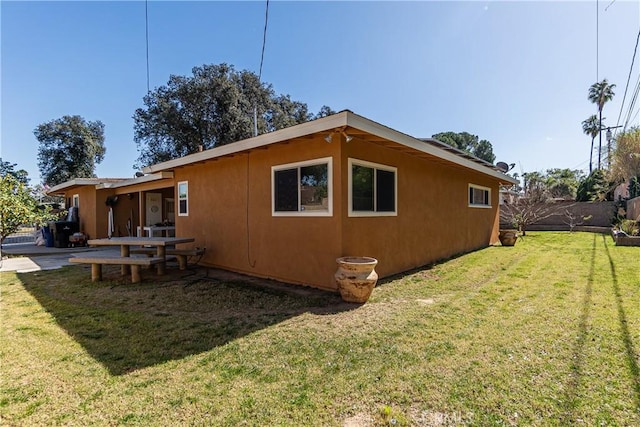 view of property exterior with a yard