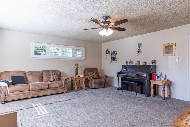 carpeted living room with baseboards, visible vents, a ceiling fan, and a textured ceiling