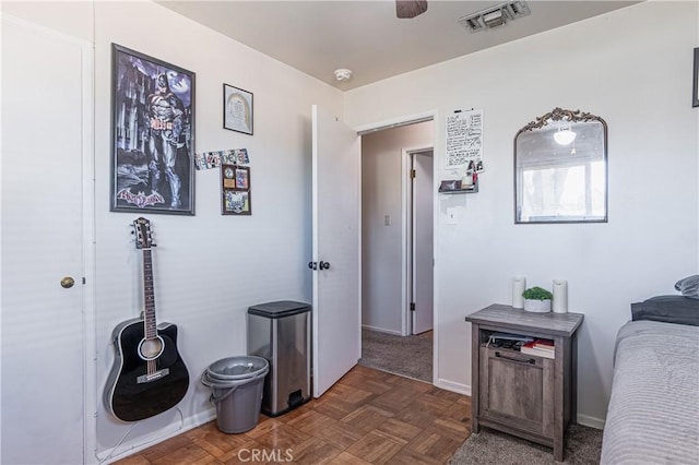 bedroom with visible vents and baseboards