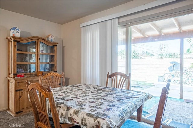 dining space with light carpet