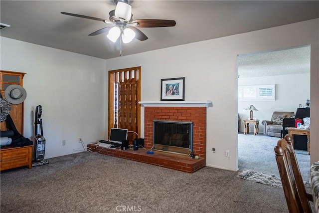 carpeted living room featuring ceiling fan, a fireplace, and visible vents