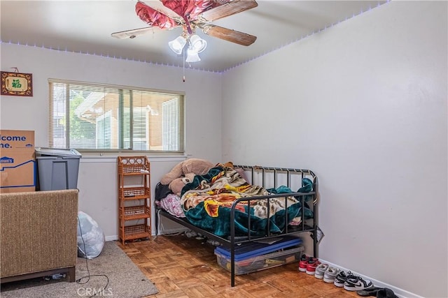 bedroom featuring baseboards and a ceiling fan