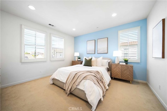 bedroom with light carpet, baseboards, and recessed lighting