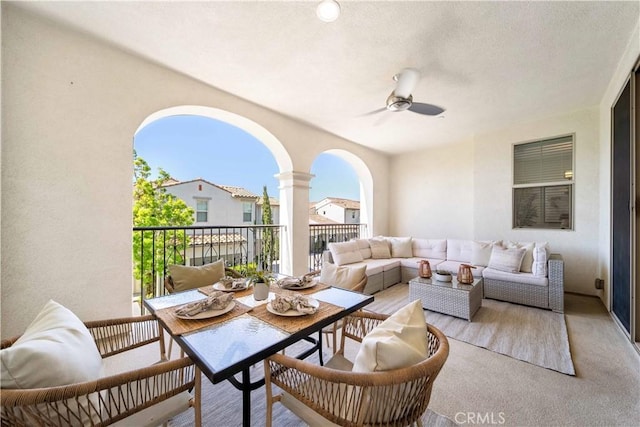 balcony with outdoor lounge area and ceiling fan