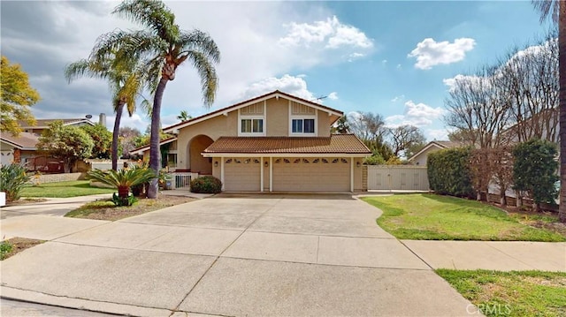 view of front of property with a garage, concrete driveway, a front lawn, and stucco siding