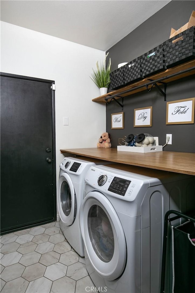 laundry area featuring laundry area and independent washer and dryer