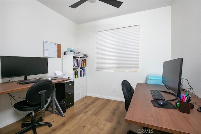 office featuring light wood-type flooring, ceiling fan, and baseboards