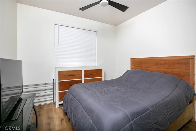 bedroom with ceiling fan and wood finished floors