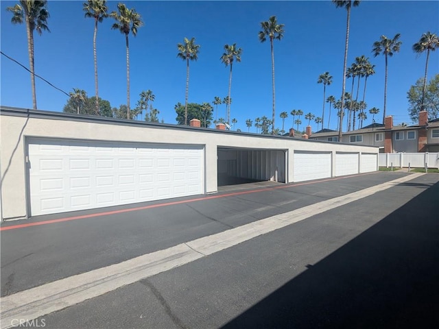 garage featuring fence