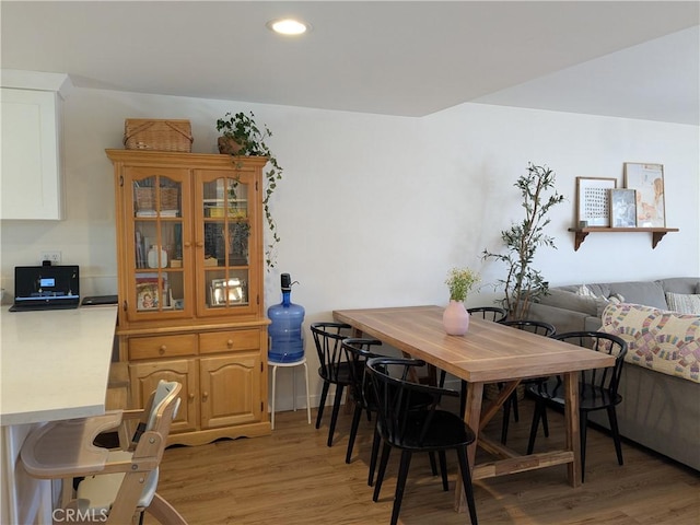 dining space featuring light wood-type flooring and recessed lighting