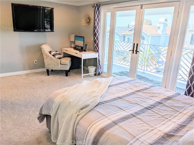 bedroom featuring baseboards, carpet floors, ornamental molding, and access to exterior