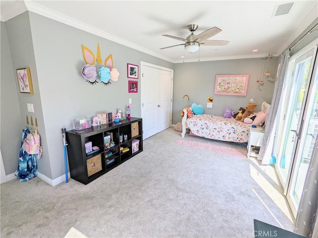 bedroom with carpet, visible vents, ornamental molding, a ceiling fan, and baseboards