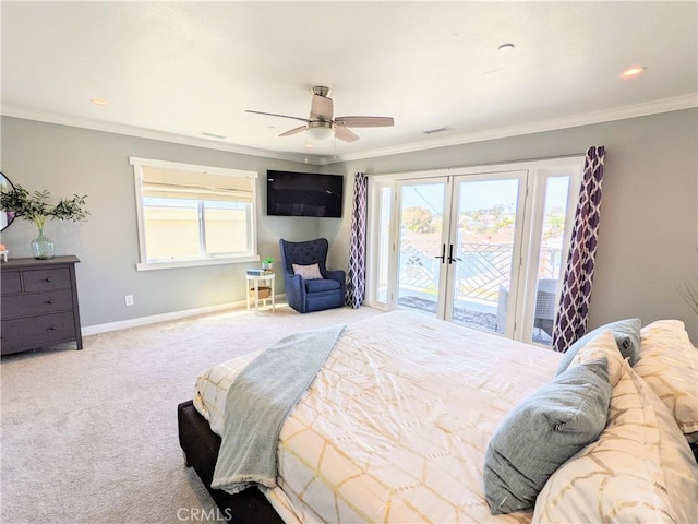 carpeted bedroom with baseboards, multiple windows, crown molding, and access to exterior