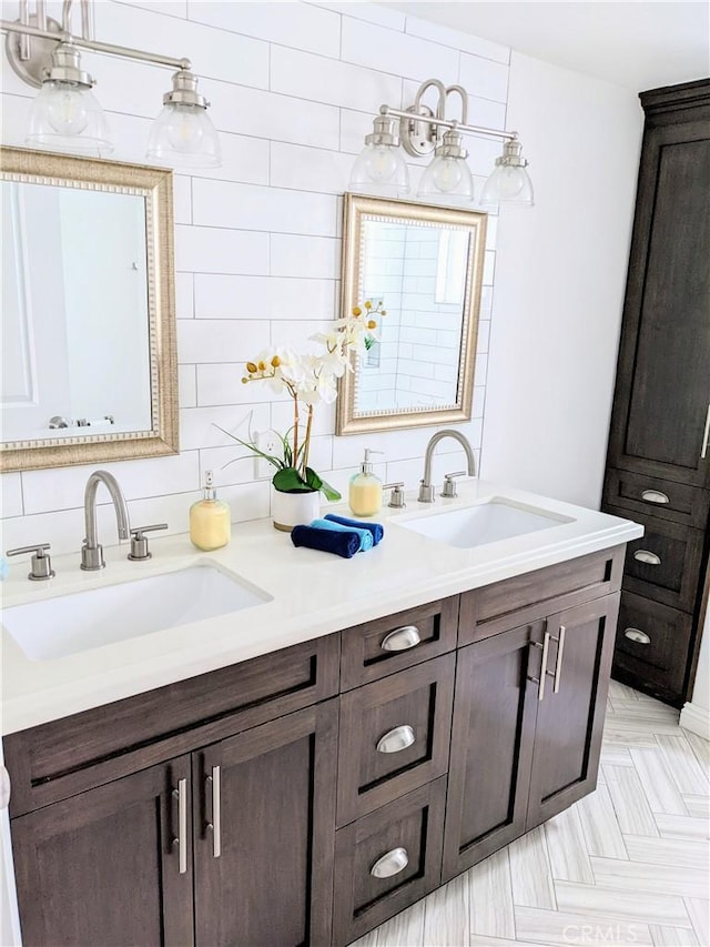 full bathroom featuring a sink and double vanity