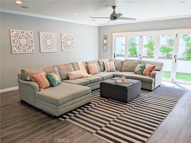 living area featuring baseboards, ornamental molding, wood finished floors, and recessed lighting