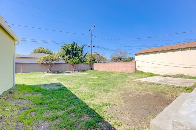 view of yard with a fenced backyard