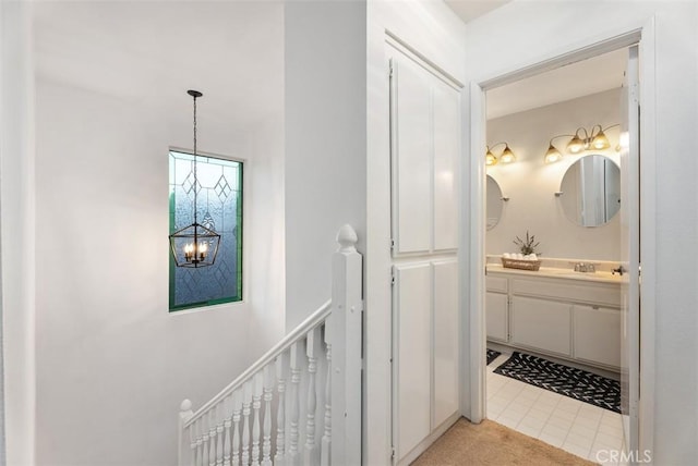 bathroom featuring a chandelier and vanity