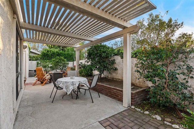 view of patio with a fenced backyard, a pergola, and outdoor dining space