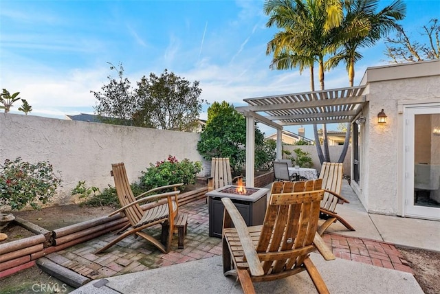 view of patio / terrace featuring an outdoor fire pit, a fenced backyard, and a pergola