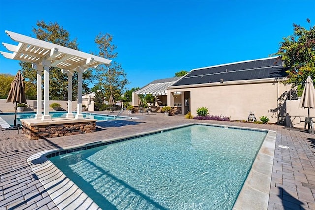 community pool featuring a patio area and a pergola