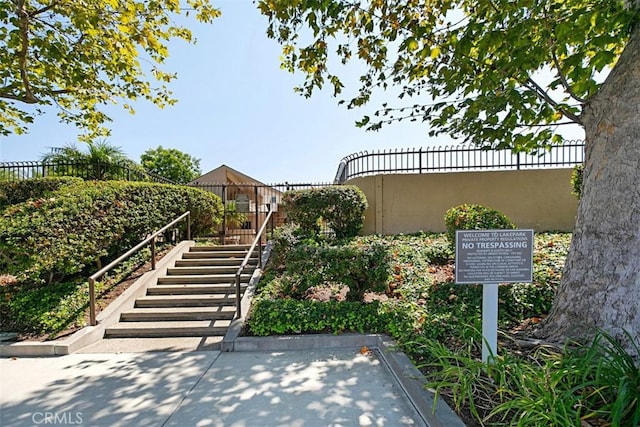 exterior space featuring fence and stairway