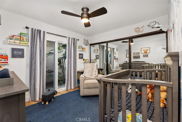 bedroom featuring wood finished floors and a ceiling fan