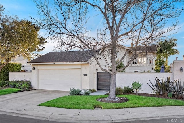 view of front of property featuring concrete driveway, fence, an attached garage, and stucco siding