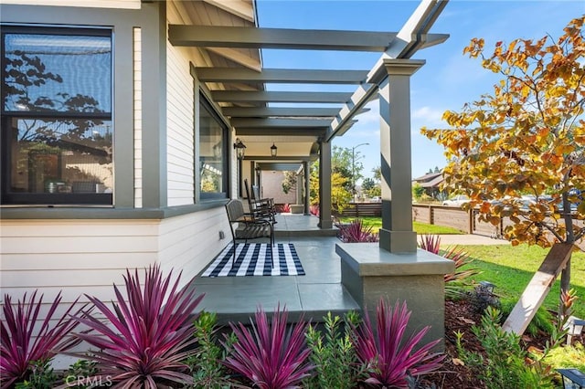 view of patio / terrace with covered porch and a pergola