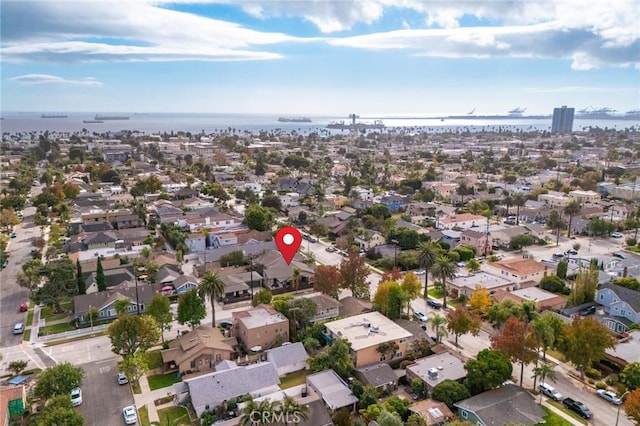 birds eye view of property with a residential view and a water view