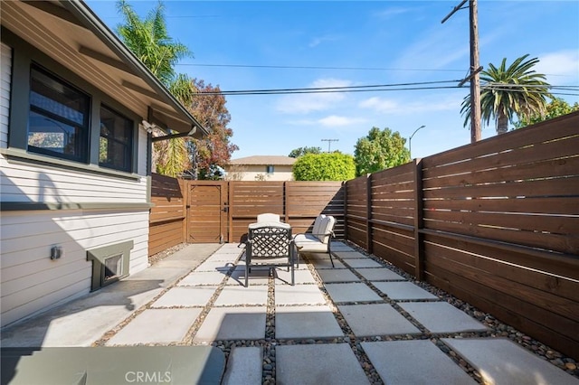 view of patio / terrace with a gate and a fenced backyard