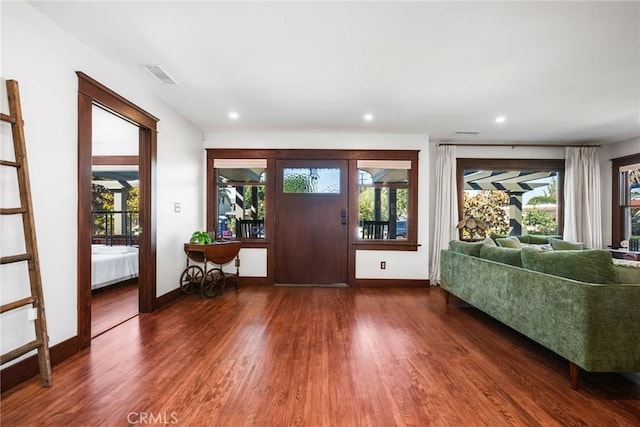 entryway with recessed lighting, visible vents, plenty of natural light, and wood finished floors