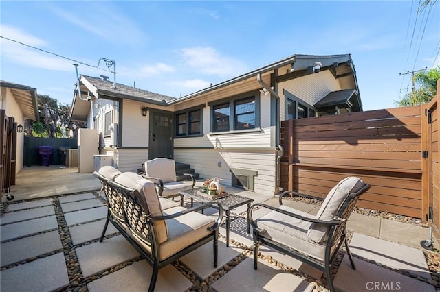 view of patio / terrace with fence and an outdoor hangout area