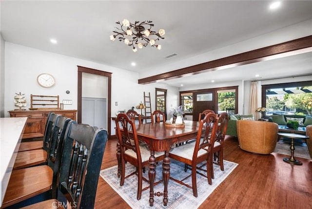 dining area with a chandelier, recessed lighting, visible vents, and wood finished floors