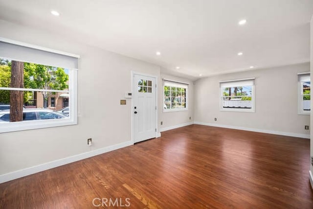 entrance foyer featuring baseboards, wood finished floors, and recessed lighting