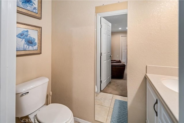 bathroom with toilet and vanity