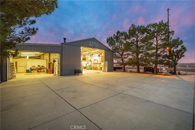 exterior space with a garage and an outdoor structure