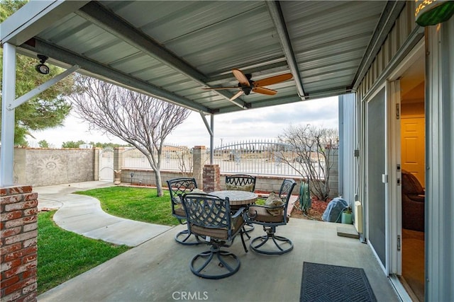 view of patio / terrace featuring ceiling fan, outdoor dining area, and a fenced backyard