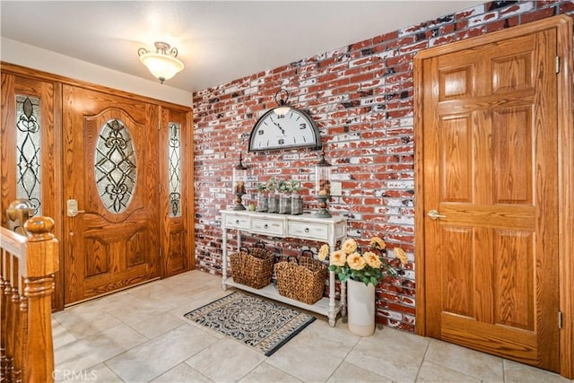 foyer entrance with brick wall