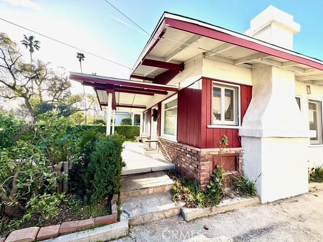 property entrance featuring board and batten siding