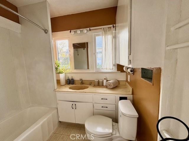 full bathroom featuring toilet, shower / bathtub combination, tile patterned floors, and vanity