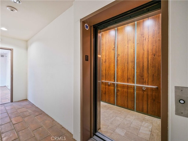 doorway to property featuring elevator