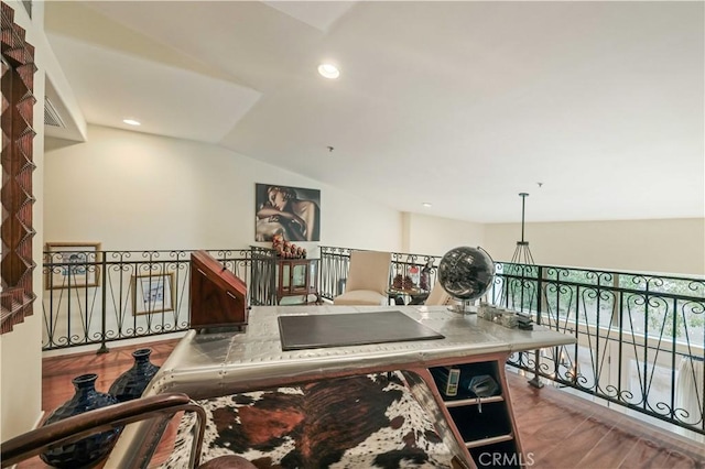 interior space with recessed lighting, vaulted ceiling, and wood finished floors