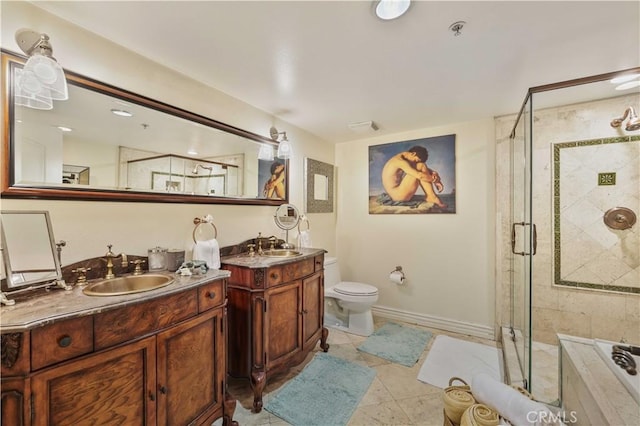 full bathroom featuring a tub, two vanities, a sink, and a shower stall