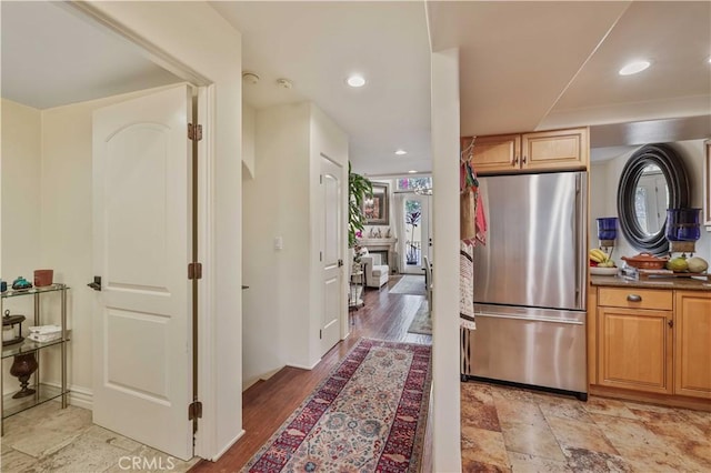 kitchen with freestanding refrigerator and recessed lighting