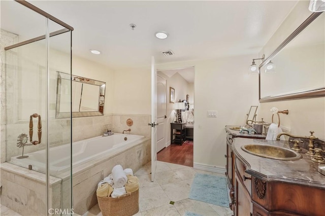 full bath featuring visible vents, a shower with shower door, tile patterned flooring, vanity, and tiled tub